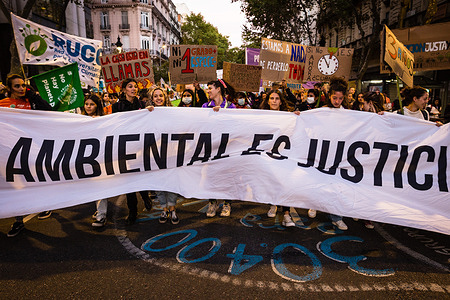 A group of young women hold a banner that says "environmental justice is social justice" as they march along the avenue of Mayo towards the Congress of the Argentine Nation during the demonstration. Social, environmental and political organizations participated in the Global March for Climate, in commemoration of Earth Day, calling for public policies that promote friendly actions with the planet and for the change of development and production models, with the objective to reduce the impact of climate change.