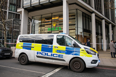 A police van parked outside the Rolex store on Knightsbridge after a suspected robbery. A motorcycle was used in a suspected robbery at the exclusive Rolex watch store in Knightsbridge, London. Police were called at 10am. As officers arrived, the scooter bike was found inside the store which they used to smash the glass. the area was cordoned off using police tape as forensic officers gathered evidence.