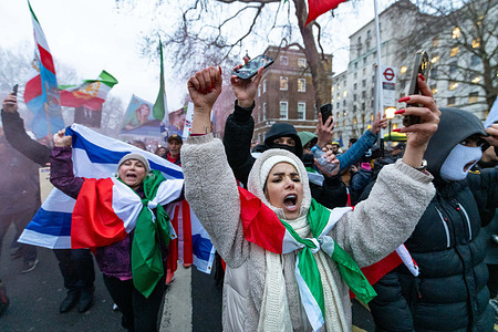 Protesters chant slogans during the demonstration. Thousands of demonstrators gathered outside Downing Street in central London amid a wave of anti-government protests in Iran. Protesters from the Iranian diaspora called for the overthrow of the Islamic Republic and voiced support for the restoration of the monarchy, with many displaying Iranian national flags and images of Shah Mohammad Reza Pahlavi.