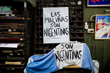 A poster and an Argentina flag with the legend “Las Malvinas son Argentinas” inside a shop that decorates T-shirts and flags with the phrase "The Malvinas are Argentine". One week after the World Cup final, Argentina is still celebrating the victory and the assertion of sovereignty over the Malvinas Islands made by the Argentine national team players at the end of the match with a banner reading "the Malvinas (Falkland) Islands are Argentine”. Argentina defeated England 2–1.