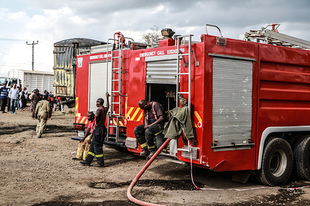 A fireman rests on his engine after quelling a blaze that gutted multiple oil tankers early Saturday morning in Nakuru. Two people suffered burns after multiple oil tankers parked by the roadside caught fire and were completely damaged in early morning inferno in Nakuru. The cause of the accident is under investigation.