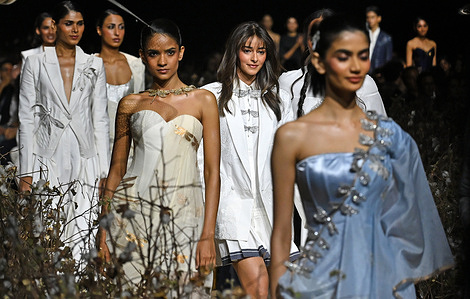 Bollywood actress Ananya Panday (second from right) wearing designer Rahul Mishra's creation walks the ramp on the second day of Lakme Fashion Week (LFW) in Mumbai.