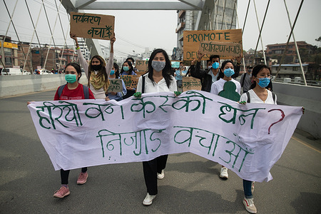 Environmental activists marching with a huge banner during the demonstration against the decision to build the Nijgadh International Airport in Bara, which is believed to lead to the cutting of trees and loss of biodiversity.
The airport is about 80 kilometers (50 miles) south of the capital of Nepal. It's estimated that 2.4 million trees will have to be cut down to build the airport, which is expected to cost $3.5 billion.