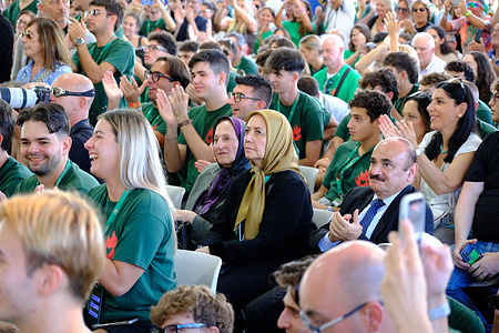 As part of the conference, the organizers officially invited a delegation of the National Council of Resistance of Iran (NCRI). The delegation was led by Mrs. Sarvnaz Chitsaz, (Middle) Chair of the NCRI Women’s Committee. She is listening to the Italian Prime Minister Giorgia Meloni's closing remarks at the festival. Attendees gathered at the EUR lake during 'Fenix,' the national festival organized by the National Youth (Gioventù Nazionale) the youth wing of Brothers of Italy (Fratelli d'Italia) held under the slogan "The Time of Courage," the four-day gathering features debates and panel discussions on politics and culture involving government ministers, parliamentarians, local administrators, and journalists.