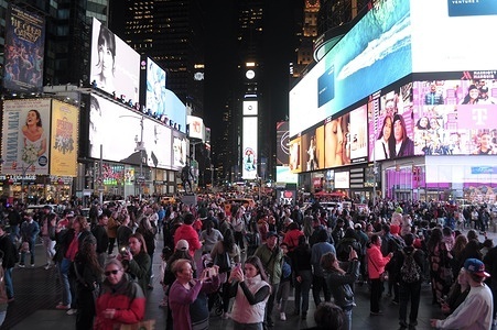 People are seen in Times Square, Manhattan, New York City.
