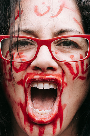 An Iranian woman living in New York repeatedly shouts 'agazi' - freedom in Farsi. On her face, the words "Woman, Life, Freedom" are written in red lipstick. Over her mouth, she has painted cross-crossing lines to signify the silencing of women in Iran. Woman, Life, Freedom protest against Iran's hardline Islamic regime held in New York. Protests broke out after Mahsa Amini's death in the custody of Iran's so-called moral police.