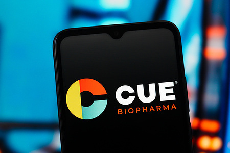 In this photo illustration, the Cue Biopharma logo is seen displayed on a smartphone screen.