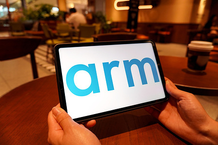 In this photo illustration, the Arm logo is displayed on the screen of a smart tablet.