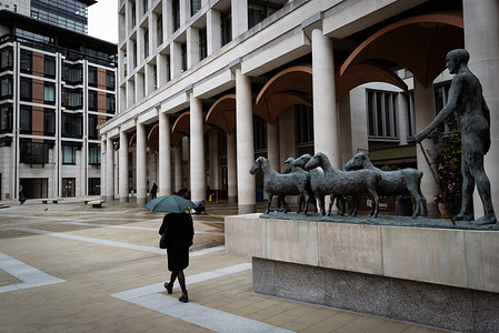 A commuter seen walking towards the London Stock Exchange after a turbulent week marked by Trump's war with Iran. The pressure on the FTSE 100 has intensified after Wall Street suffered its worst session since the start of the war. Oil prices are up and weaker retail figures have impacted the UK economy.