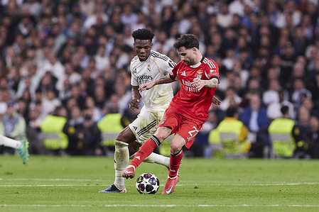 Aurelien Tchouameni (L) of Real Madrid CF and Rafael Alexandre known as Rafa (R) of SL Benfica seen in action during the UEFA Champions League 2025/2026 knockout play-off second leg match between Real Madrid CF and SL Benfica at Santiago Bernabeu Stadium. Final score Real Madrid CF 2 : 1 SL Benfica