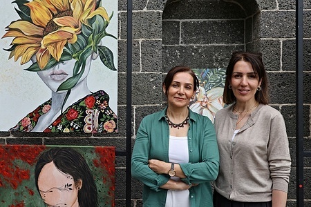 Painter Bahar Azizoglu Ergul (R) is seen with the exhibition curator Sevginc Tanyildiz. The exhibition "Women of Spring," featuring 52 works by painter Bahar Azizoglu Ergul, opened at the historic Cemil Pasha Mansion in Diyarbakir, Turkey. The exhibition was hosted by the Diyarbakir Metropolitan Municipality and curated by Sevinc Tanyildiz.