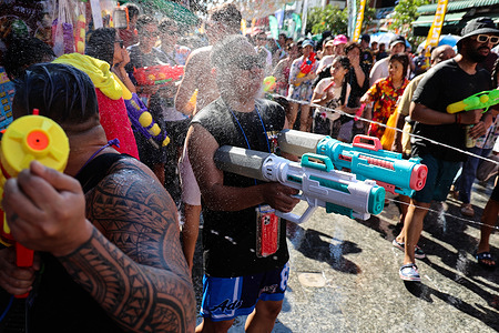 A reveler takes part in a water fight during the Songkran festival celebrations on Khao San Road.
