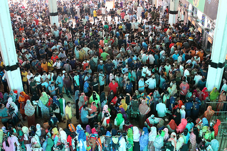 Muslims are seen crowded at the city's central railway station to buy advance train tickets to travel to their homes ahead of Eid al-Fitr festival in Dhaka, Bangladesh.