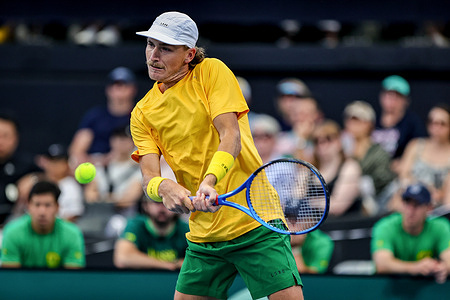 Max Purcell hits a backhand in his doubles Davis Cup match for Australia versus Poland, being held at Pat Rafter Arena. The Polish pair was Karol Drzewiecki and Jan Zielinski. Australia won the match 7-6, 6-3; the tie is a World Group I playoff.