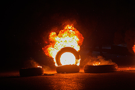 Palestinian demonstrators burn tires and block the road leading to Joseph's Tomb in the city of Nablus in the occupied West Bank. Demonstrators made a bold move to prevent Israeli settlers from going to Joseph's Tomb after staging demonstrations, attacking Palestinian property, and closing the streets surrounding the city of Nablus. This tomb has long been at the center of conflict between Jews, Christians, and Muslims. Some Jews believe that Biblically, Joseph is buried in the grave; Muslims believe that Sheikh, an Arab leader, is buried inside. Joseph's tomb is located in Balata village in the suburb of Nablus on the northern West Bank.