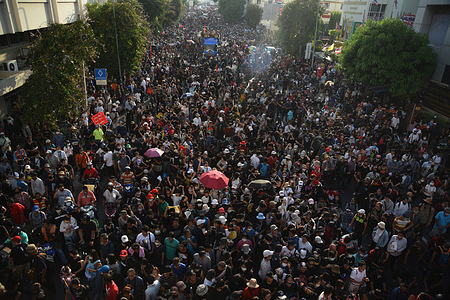 Crowd of protesters walking towards Thai Government House during the demonstration.
Hundreds of anti-government protesters and students on the 47th anniversary of the 1973 Thailand uprising, attend a huge demonstration of the United Front of Thammasat and Demonstration group demanding Prayut Chan-o-cha, Prime Minister to resign and give true democracy to people and royalist reforms.