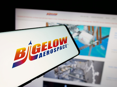 In this photo illustration, a smartphone with the logo of US space design company Bigelow Aerospace is seen on screen in front of website.