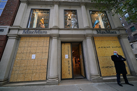 A boarded-up MaxMara along Madison Avenue in New York City.