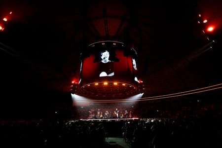 Portuguese singer, Rui Veloso performs live accompanied by his band members, guitarists Alexandre Mania and Eduardo Espinho during a concert at the Super Bock Arena.