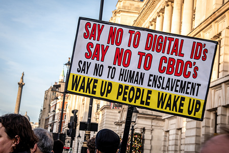 A protestor holds a placard during the "Say No To Digital ID" March. Thousands marched through London in protest against Digital ID plans.