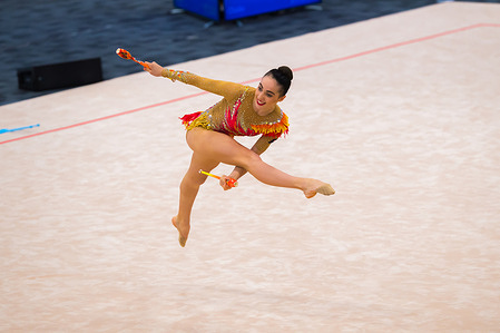 New Zealand Senior International Rhythmic Gymnast, Havana Hopman seen catching a club from under her leg in a leap during the 2022 Oceania Rhythmic Gymnastics Continental Championships. The event was running in parallel with Australian Gymnastics Championships on Gold Coast, Queensland.