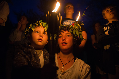 Mother and son hold a torch as they climb Krakau Mound during the Beltane feast of Fire in Krakow.
The Beltane Fire Festival is an annual participatory arts event held on the night 30 April to mark the beginning of the Summer.