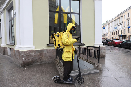 A courier of Russian delivery service Yandex Eda in a protective mask rides past Macdonalds restaurant.
All days until 30 April were declared off work days by President Vladimir Putin. Russia has 6 343 confirmed cases of COVID-19.