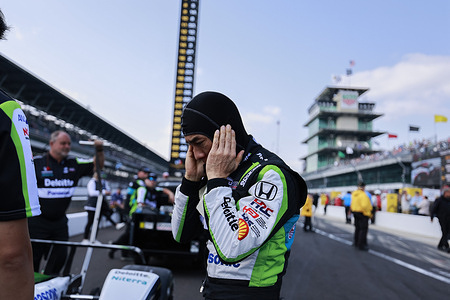 Takuma Sato (11) of Chip Ganassi Racing waits to qualify again for the 2023 Indy 500 at Indianapolis Motor Speedway in Indianapolis.