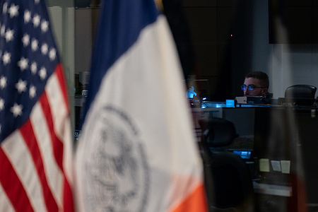 An employee of the New York City Emergency Management office looks over displays in the control center during New York City Mayor Zohran Mamdani's press briefing on the upcoming winter storm in New York.