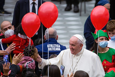 Pope Francis greets and blesses the children assisted by the Vatican's Santa Marta Pediatric Dispensary at the Paul VI Hall.