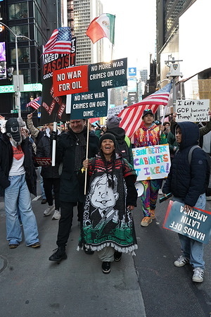 Protestors hold placards expressing their opinion during the Anti Ice, Anti Trump and Anti War Rally. After the Ice Agent, James Ross's, murder of Renee Good an American Citizen in Minneapolis and two subsequent Ice shootings in Portland Oregon. The organized rally called No Wars, No Kings, No Ice invited people to speak up and march in honor of Renee Good and other citizens effected by ICE officers. Over 75,000 protestors met on 5th Avenue and walked in mass down Fifth Avenue to 42nd street and turned to Times Square.