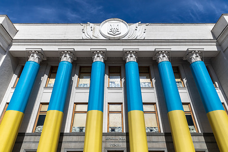 The Verkhovna Rada of Ukraine building is seen featuring sandbags placed behind windows. A solemn flower-laying ceremony was held at the memorial plaque dedicated to the deputies who lost their lives as a result of Russian aggression. Those present honored the memory of their colleagues with a minute of silence, paying tribute to their courage and self-sacrifice for the freedom of Ukraine. This memorial has become a symbol of eternal remembrance for the people's representatives who gave their lives in the struggle for independence.