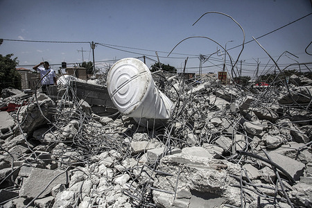 A Palestinian man inspects a Palestinian house demolished by the Israeli army under the pretext of construction in Area C, classified according to the Oslo Accords, in the village of Al-Auja near Jericho in the West Bank. An agreement was reached between Israel and the Palestinian Authority in the village of Al-Auja, near the city of Jericho in the West Bank.
