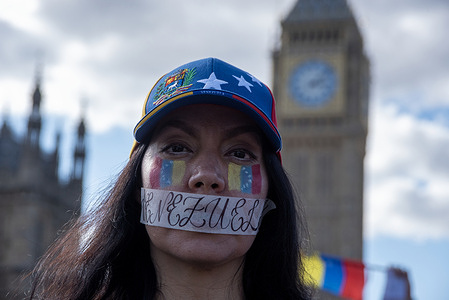 A face painted protester mouth is taped to symbolise silencing the Venezuelan people. Venezuelan diaspora gathered on the Parliament Square in London to show their solidarity with their people back at home. Soon after the presidential elections results were released civil unrest started in Venezuela against the Nicolas Maduro administration because of the Venezuelans think the election was controlled and unfair.
