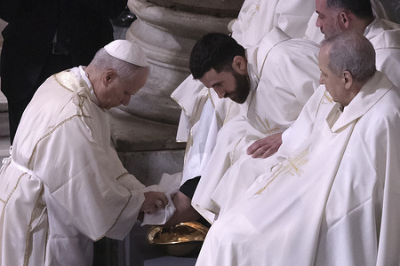 Pope Leo XIV washes the feet of priests during the Mass of the Lord’s Supper on Holy Thursday at the Papal Basilica of St. John Lateran in Rome.