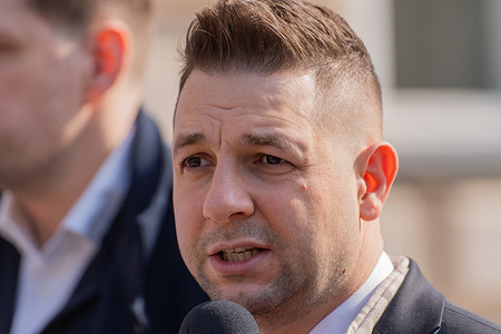 Patryk Jaki, Member of the European Parliament from Law and Justice (PiS) speaks during a meeting with students. Patryk Jaki, Member of the European Parliament from Law and Justice (PiS), and Tobiasz Bochenski, Member of the European Parliament from Law and Justice (PiS), held an open meeting from the “Zmien Nasze Zdanie” series based on discussions between Polish politicians and students about the future of Poland in the European Union. Around one hundred students gathered for discussion in front of the main gate of University of Warsaw on Krakowskie Przedmiescie in Warsaw.