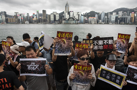 Protesters hold placards during the anti government demonstration at the Victoria harbour.
Thousands of anti-government protesters marched and rallied to the West Kowloon High Speed Railway Station to demand the Hong Kong government to withdraw the extradition bill and to set up an independent commission to investigate on the police brutality while they used force to handle the protesters during the anti-extradition bill protests in June.