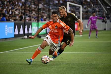 Forward Ezequiel Ponce (10) of Houston Dynamo FC and Defender Ryan Porteous (5) of Los Angeles FC battle for the ball during an NWSL match between Los Angeles FC and Houston Dynamo FC at BMO Stadium