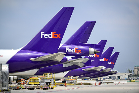 FedEx Express aircraft are seen parked at Los Angeles International Airport in Los Angeles, California. Major cargo carriers continue to stage aircraft at key U.S. hubs like LAX as global supply chain and air freight demand remains steady during the peak summer travel and shipping season.