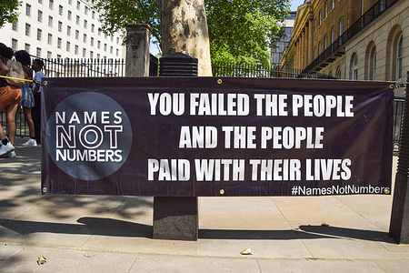 A Names Not Numbers banner displayed outside Downing Street in London during the protest.The organization campaigns to remember the lives lost to the coronavirus and to hold the government responsible for what the activists calls "negligence and lack of action during the COVID-19 crisis".