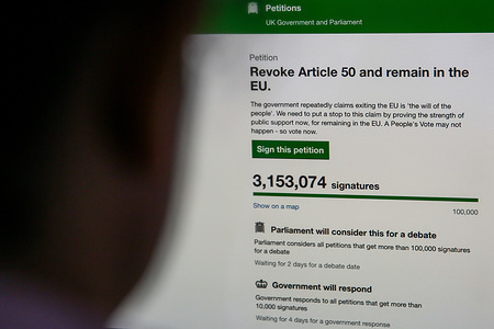 A woman in seen viewing the UK Government's Petition website where over three million people have signed the "Revoking Article 50 Petition" calling for British Prime Minister Theresa May to cancel Brexit by revoking Article 50.