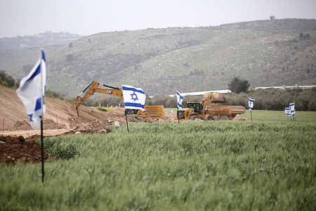 Israeli bulldozers are razing Palestinian-owned land near the Jewish settlement of Snanur. Jewish settlers have returned mobile homes and raised Israeli flags around the Snanur settlement, south of Jenin in the West Bank. Snanur was one of four settlements in the northern West Bank evacuated in 2005 as part of the "disengagement" plan.