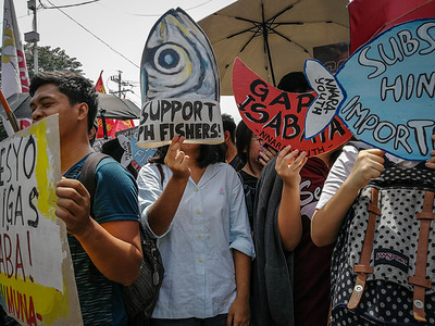 Protesters seen holding placards during the demonstration.
Militant groups march to Mendiola with their placards and kitchen utensils urging Duterte government to scrap Tax Reform for Acceleration and Inclusion Law or TRAIN Law that is the cause of high prices of basic commodities in the Philippines such as rice.