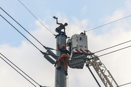Rescue personnel and family members negotiate and talk with Dennis Tragura, 39, at the top of high tension wire in Marikina City. According to the family, Dennis is depressed as a result of his child's death and has separated from his wife. The rescue effort, according to officials, lasted 31 hours. Mental illness is becoming a common disability in the Philippines, according to the World Health Organization (WHO), with at least 3.6 million Filipinos suffering from mental, neurological, and drug use diseases. According to the WHO, the Philippines has a 3.2 per 100,000 suicide rate, with males having a higher incidence (4.3 per 100,000) than females (2.0 per 100,000). Mental illnesses are the third leading cause of disability in the Philippines. In assessing the Philippine Mental Health System. Mental health stigma remains in the Philippines, leading in underdiagnosis and misdiagnosis.