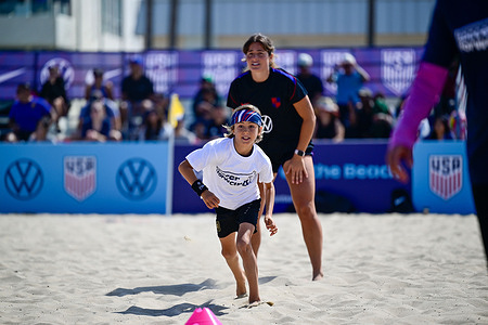 A participant takes part in beach soccer activities at Venice Beach. Youth participants take part in beach soccer activities during the Soccer Forward Foundation Beach Soccer Community Activation at Venice Beach in Los Angeles, California.