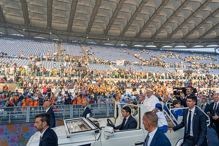 Pope Francis leaves the Olympic Stadium during the World Children's Day (WCD) event. Around 50,000 children from various countries gathered in Rome's stadium to celebrate the first-ever World Children's Day (WCD) with Pope Francis. During the event, Pope Francis urged the children to pray for their peers suffering from war and injustice and encouraged them to keep dreaming of a better future.