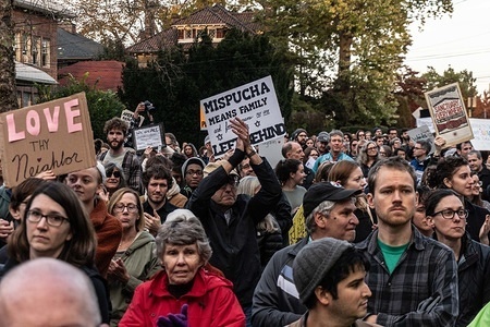 Protesters walking past the police station where the first responders stand. They clap and cheer the heroes who risked their lives. 
As President Trump arrives to pay his respects to the victims of the Tree of Life synagogue in Pittsburgh, hundreds took to the street marched and protested in solidarity to voice their concerns about Trump's policies and to stand up against hate of all kinds.