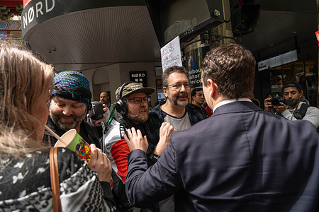 A member of the public is seen yelling about the pro Palestine protest, during the anniversary. People gather in Melbourne the for the 1 year anniversary of the conflict between Palestine and Israel.