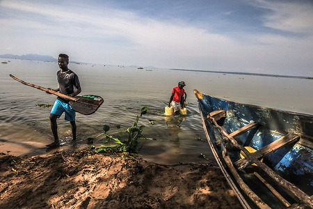 Locals on a busy day by the lake shore in Ralayo Asembo.
Life on the lakeside seems uneasy to residents who strive to survive through everyday life and the daily occurring circumstances due to high birth rates and lack of jobs around the regions. In Ralayo Asembo, Kisumu City, most locals are left with no other sources and access to clean water, most local villagers around here depend on the lake for drinking, cooking, washing, and most importantly for livestock and agricultural purposes. For many years, the highly polluted lake has become a breeding ground for diseases leaving the lives of most residents at risk of outbreaks of waterborne diseases .