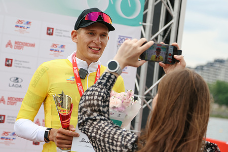 Kirill Miller from Volga Union team in yellow jersey poses for photos after winning ITT stage (Individual Time Trial) on Five Rings of Moscow 2026. Cycling road race «Five Ring of Moscow» is one of the oldest competitions in Russian sport and held in Moscow from 1920. 106th Edition of Five Rings held on May 15-19, 2026 and includes five stages in central Moscow and brings together 110 riders from Russia, Belarus, France and Syria.